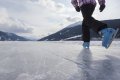 Ice skating on the lake Reschensee 